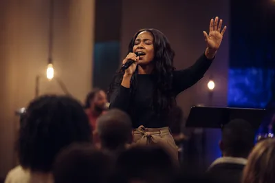 Woman Singing on Church Stage