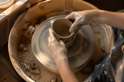 Hands Shaping Clay in Art Class