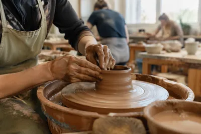 Hands Shaping Clay in Art Class