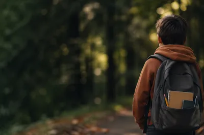 Child with Backpack and School Supplies
