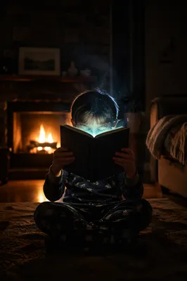 Child Reading by Magical Firelight