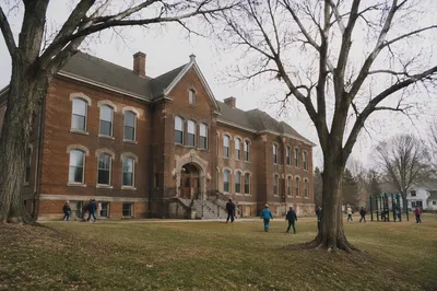 Historic Brick School Recess Playground Scene