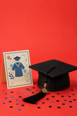 Graduation Cap Celebration on Coral Background