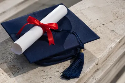 Graduation Cap and Diploma Celebration Still Life