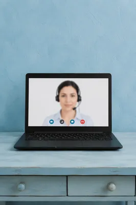 Online Learning Laptop on Blue Desk