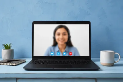 Online Learning Laptop on Blue Desk