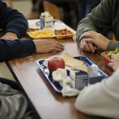 Friends Sharing Lunch at School Cafeteria