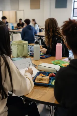 Friends Sharing Lunch at School Cafeteria