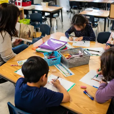 Students Learning Around a Classroom Activity Table