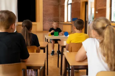 Attentive Students in Bright School Classroom