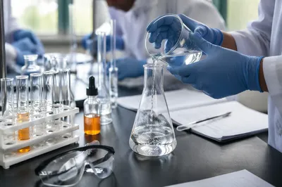 Students Chemistry Experiment with Beaker and Flask