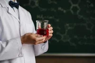 Student Holding Beaker in Chemistry Lab