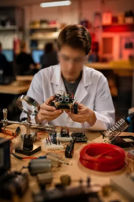 Young Student Building Robotics in STEM Lab