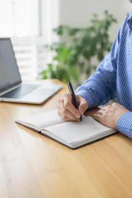 Focused Student Studying With Laptop and Notes