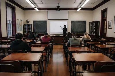 Teacher at Whiteboard in Calm Classroom