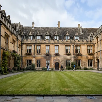 Students Walking Through Historic University Courtyard