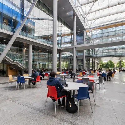 Modern University Atrium with Studying Students