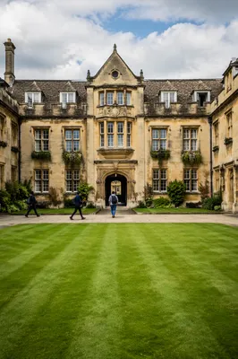 Students Crossing Historic University Campus Courtyard