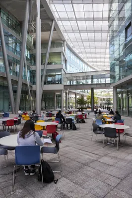 Modern University Atrium with Studying Students