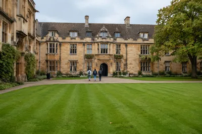 Students Walking Through Historic University Courtyard