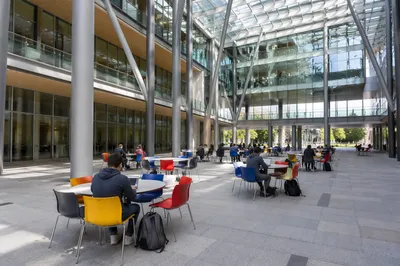 Modern University Atrium with Studying Students
