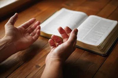 Anxious Hands Reaching for Biblical Comfort