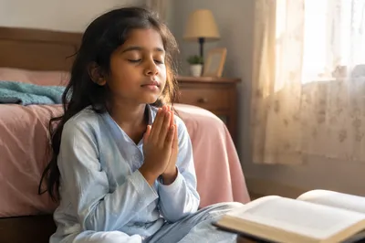 Young Girl Praying Beside Bed at Dawn