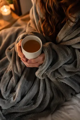 Cozy Blanket Comfort by Warm Candlelight