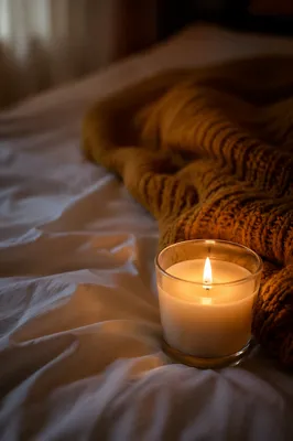 Warm Candlelight Comfort on White Bedding