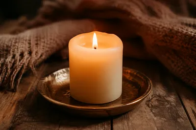 Comforting Candlelight with Warm Knitted Blanket
