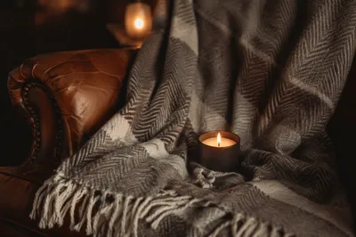 Warm Candlelight on Cozy Wool Blanket