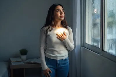 Thoughtful Woman by Rainy Window Light
