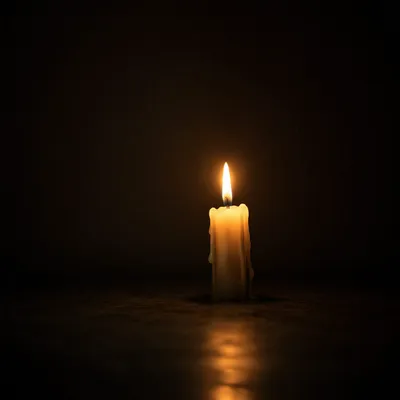 Single Candle in Vast Darkness