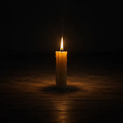 Single Candle in Vast Dark Room