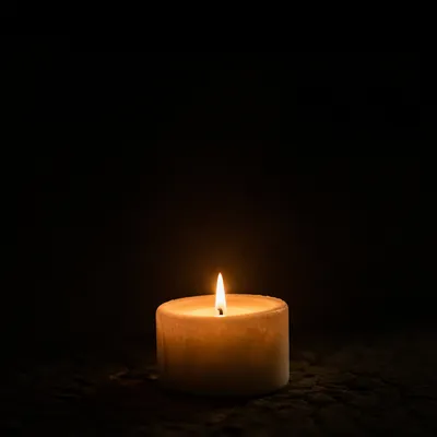 Single Candle Courage in Vast Darkness