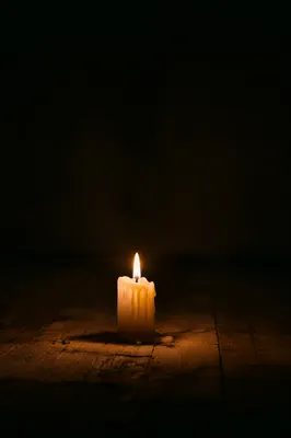 Single Candle Burning in Dark Room