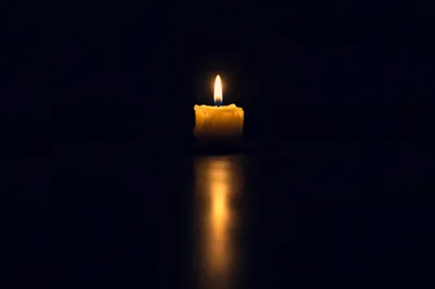 Single Candle of Courage in Darkness