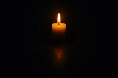 Single Candle of Courage in Darkness
