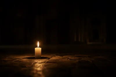 Single Candle of Courage in Darkness