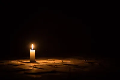 Single Candle of Courage in Darkness