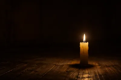 Single Candle Burning in Dark Room