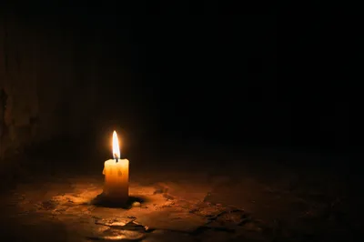 Single Candle of Courage in Darkness