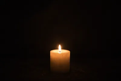 Single Candle of Courage in Darkness