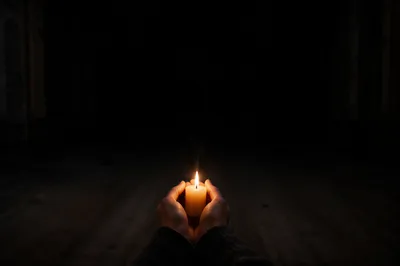 Single Candle of Courage in Darkness