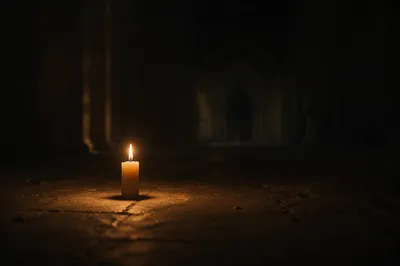 Single Candle of Courage in Darkness