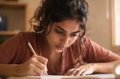 Focused College Student Studying at Desk