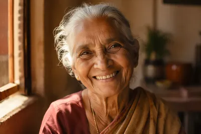 Smiling Elderly Woman by Sunlit Window