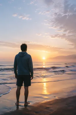 Lone Figure Watching Ocean Sunrise