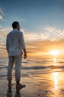 Man Watching Sunrise Over Endless Ocean