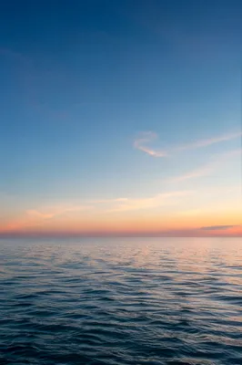 Eternal Sunrise Over a Calm Endless Ocean